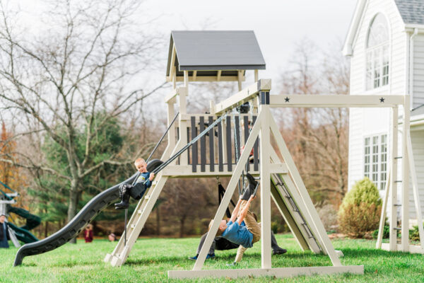 almond and gray swing set