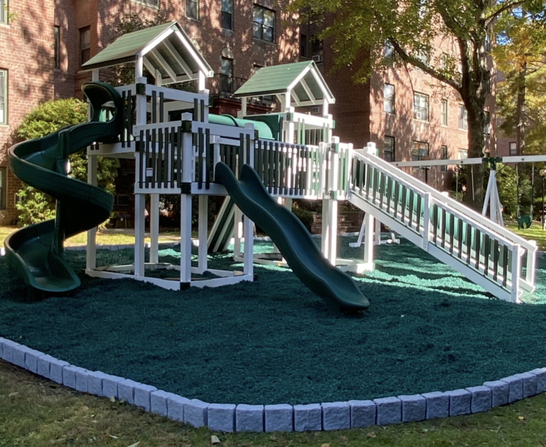 large commercial swing set with rubber mulch